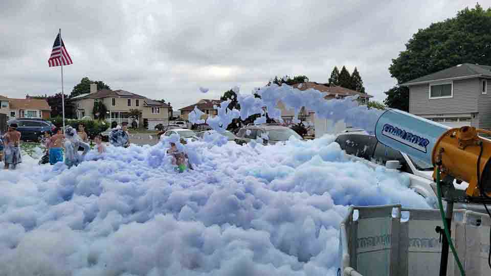 Crowd at an outdoor foam party during daytime