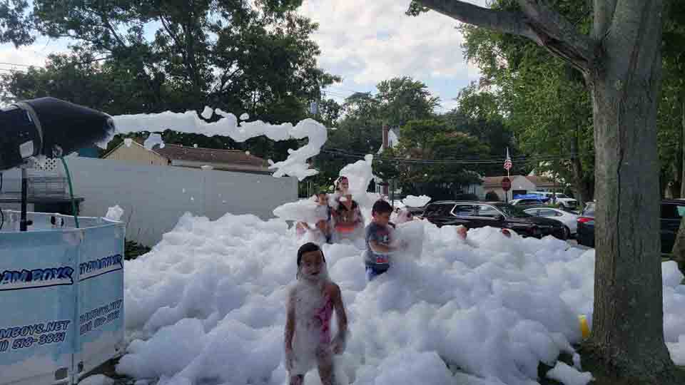 Outdoor foam party with bright sunshine