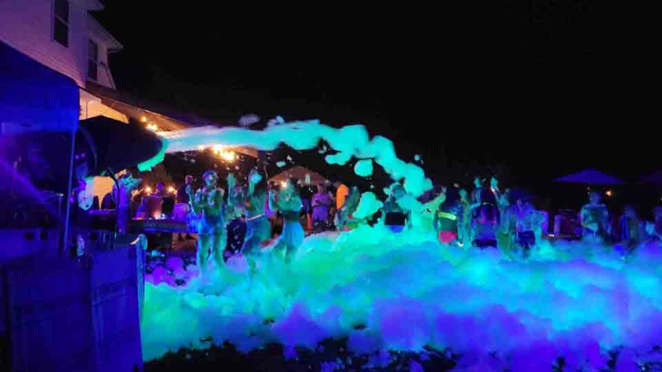 DJ playing music at a foam party event